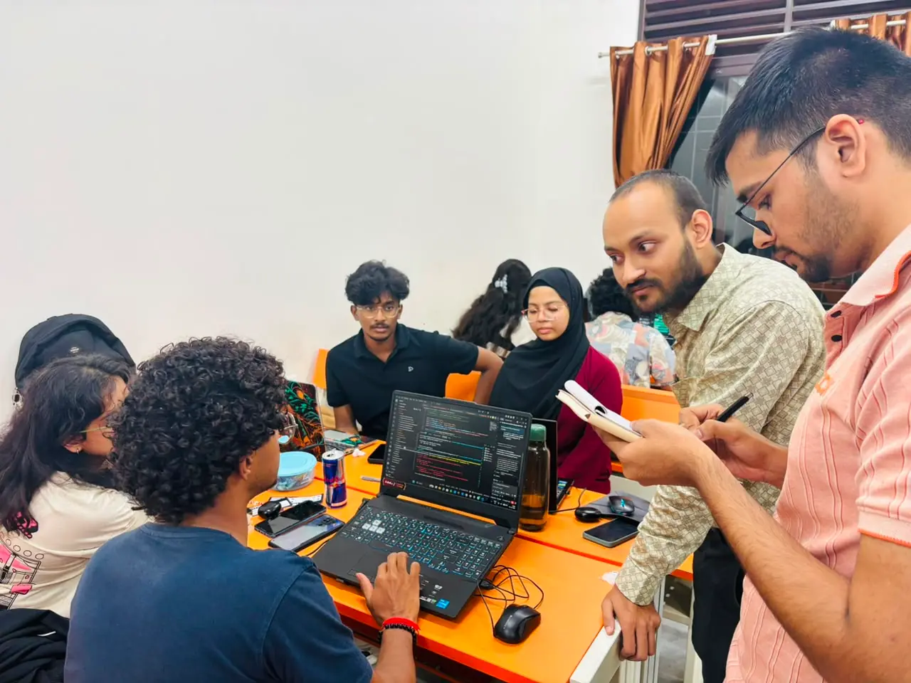 Amit Kumar Singh reviewing code with a team